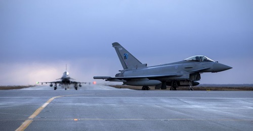 A pair of RAF Typhoons taxi to their parking apron after arriving at Keflavik Air Base on 13 November.