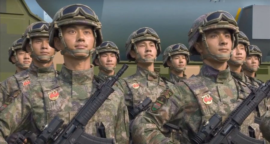 Chinese soldiers carrying a new type of assault rifle during a military parade held at Tiananmen Square in Beijing on 1 October 2019. (Via CGTN video footage)