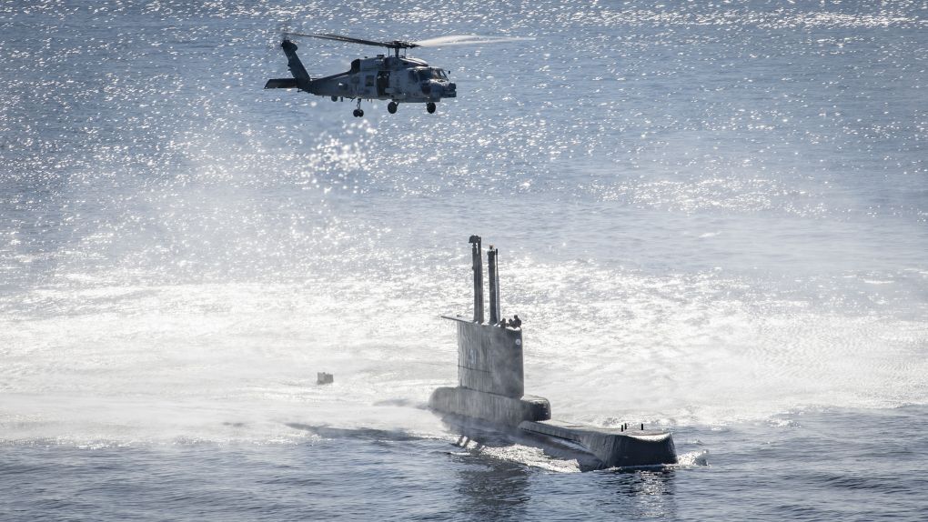 
        An MH-60R Sea Hawk helicopter conducts a hoist exercise with Peruvian Navy submarine BAP
        Angamos
        (SS-31).
       (US Navy)