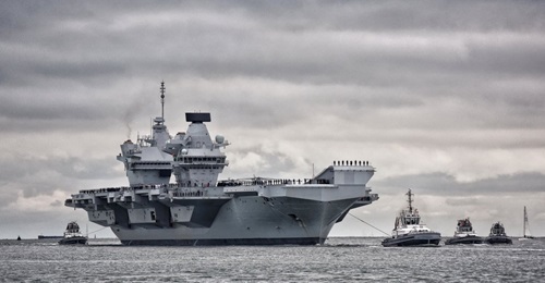 HMS 
        
         sailing into Portsmouth harbour on 16 November.