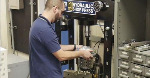 Reinhart completes final assembly of the Responsive Open Source Engine (ROSE) turbine in preparation for testing.