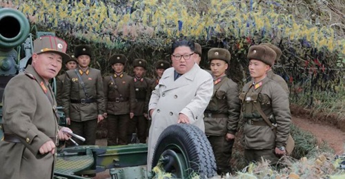 North Korean leader Kim Jong-un (centre) talking with soldiers during a visit to a military unit on Changrin Islet near the western sea border with South Korea.