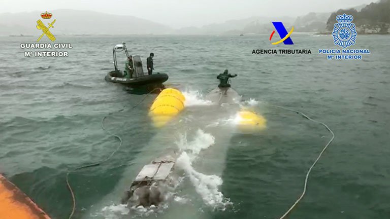 Personnel from the Spanish Guardia Civil refloating the 'narco-submarine' following its seizure. (Guardia Civil)