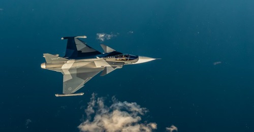 The first series-production Gripen E for Sweden, aircraft 6002, flew in a new splinter tri-tone grey camouflage pattern reminiscent of the Swedish Air Force's green and brown scheme from the Cold War.