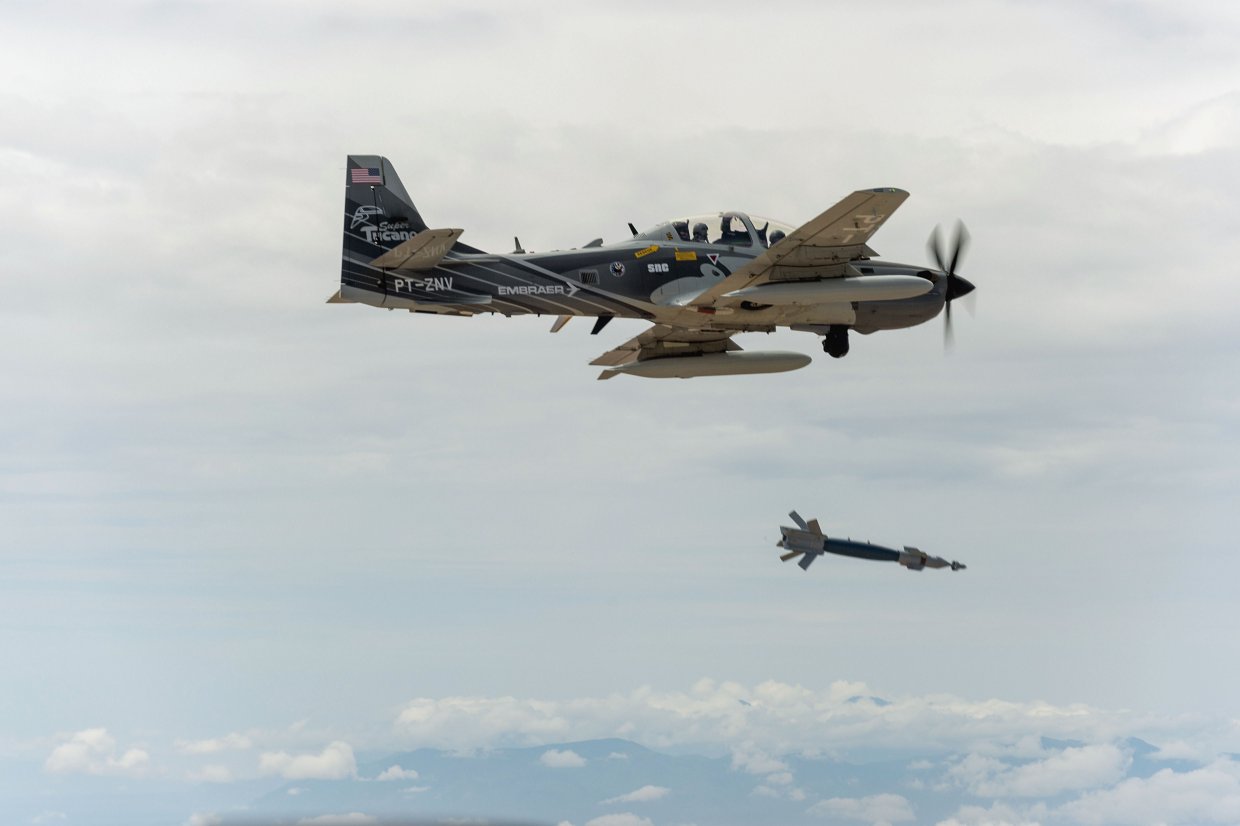 An EMB 314/A-29 Super Tucano drops a Paveway laser-guided bomb. Countries wanting to acquire systems such as Paveway will need to have improved targeting infrastructure covering areas such as collateral damage and weaponeering. (US Air Force)