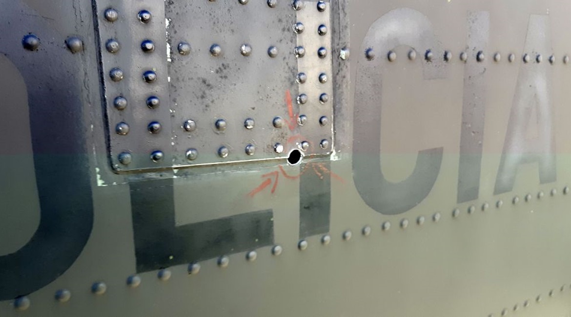 One of four 5.56 mm bullet holes in the tail of a Colombian National Police Sikorsky UH-60L Black Hawk helicopter. Since the bullet damaged vital structural components, Sikorsky Colombia is sending in a team to perform depot level repairs that the poli...