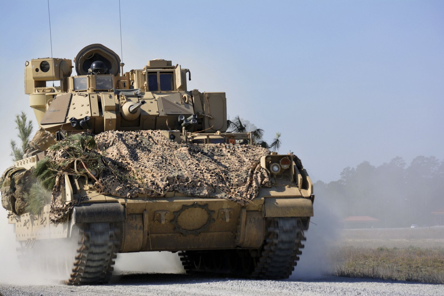 An M2A3 Bradley Fighting Vehicle from 1st Battalion, 64th Armor Regiment manoeuvres during a company Combined Arms Live-Fire Exercise at Fort Stewart, Georgia, on 7 February 2017. The OMFV is billed as a Bradley replacement. (US Army)