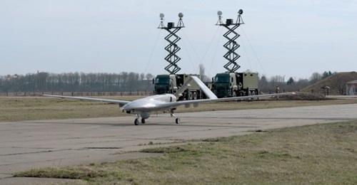 A Ukrainian Bayraktar TB2 is seen with ground control stations in the background. The same Ford 2533 trucks with elevating platforms were seen being unloaded from the cargo ship 
        
         when it docked in Tripoli on 18 May, according...