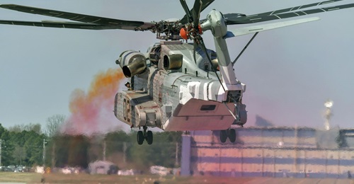 A CH-53K performs EGR testing on 4 April. The coloured oil smoke indicates rotor wake.