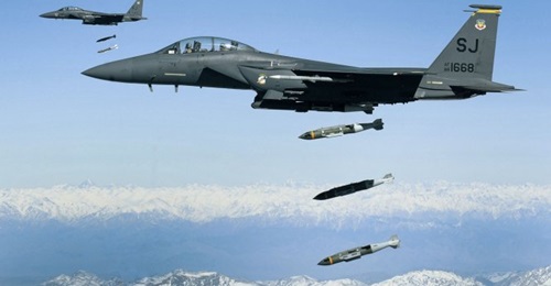 USAF F-15E Strike Eagles dropping munitions on Afghanistan at the height of the conflict some years ago. The US military has noted a reduction in the number of airstrikes for November, although the number remains historically high.