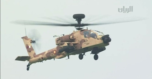 An QEAF Apache Guardian is seen in a still from Qatari TV coverage of the parade.