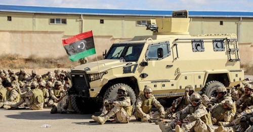106th Brigade soldiers relax next to what appears to be a TAG Terrier LT-79.
