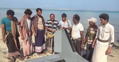 A still from a video released by Ansar Allah (Houthis) on 31 December 2019 shows armed men recovering the wreckage of an aircraft identified as a Karayel UAV operated by Saudi Arabia