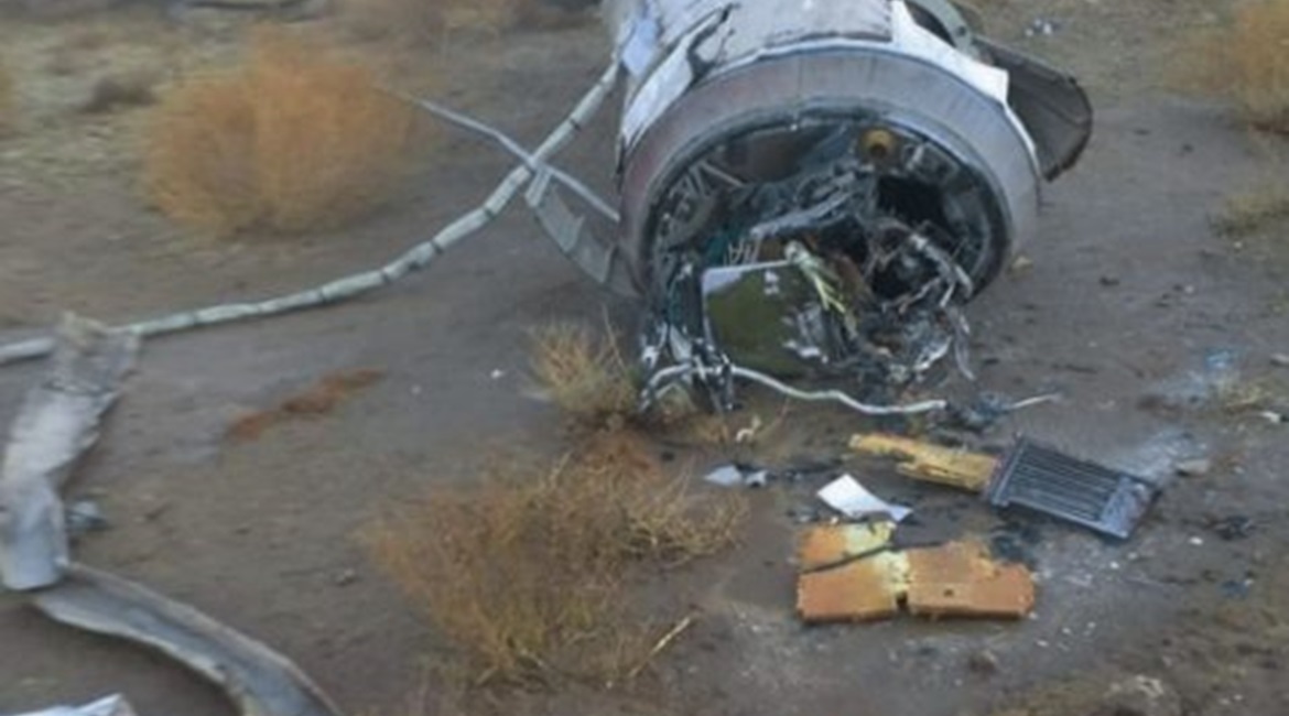 The remnants of a missile are seen near Al-Baghdadi, about 10 km from Iraq's Ain al-Asad Air Base on 8 January. It shows the top of the rocket motor where the guidance section tapers towards the re-entry vehicle, which is not present. The conduits that...