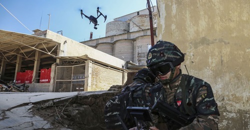 A PAP special operations soldier is seen here controlling a small reconnaissance UAV during a counter-terrorism training exercise held in southern China in late December 2019.