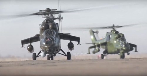 Screenshot of an Uzbekistan news report from 14 January showing at least one new Mil Mi-35M 'Hind' assault helicopter (foreground) that was recently delivered to the country. The helicopter in the background is an earlier-variant Mi-24.