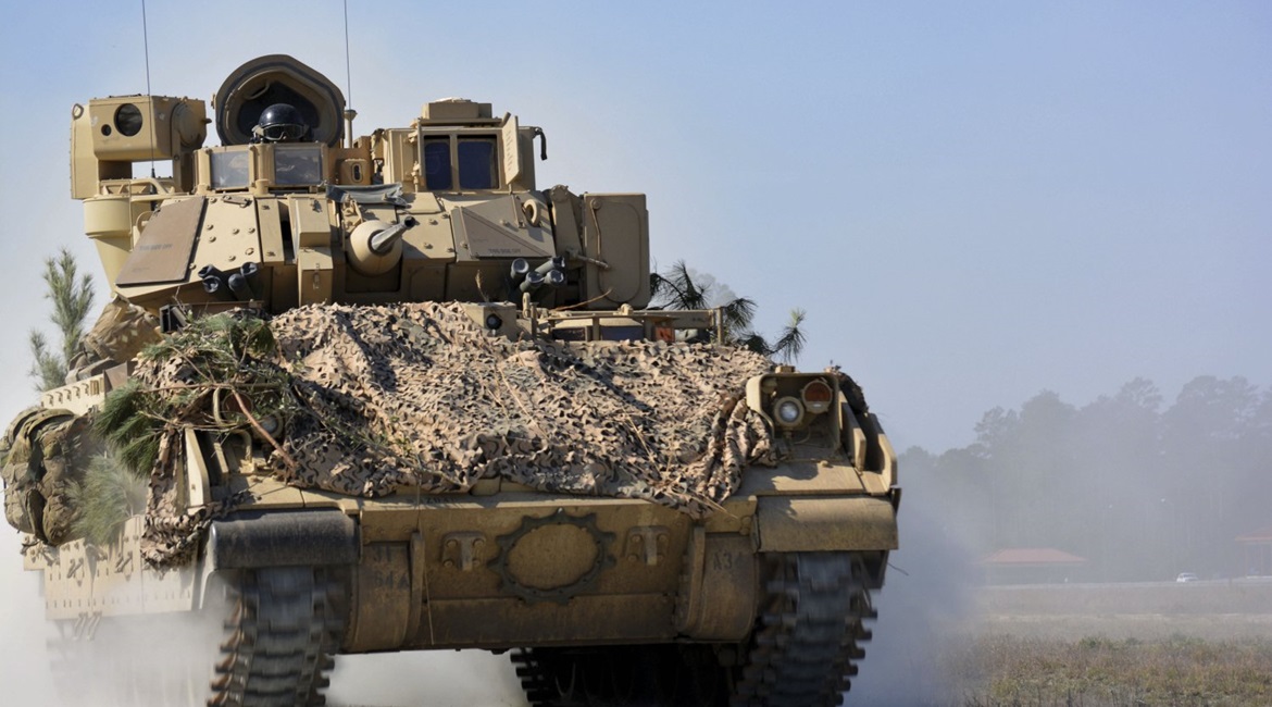 A M2A3 Bradley Fighting Vehicle from 1st Battalion, 64th Armor Regiment manoeuvres during a company combined arms live-fire exercise at Fort Stewart, Georgia, in February 2017. The US Army has now cancelled its Bradley replacement plans under an OMFV p...