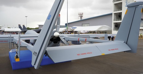 Rear view of the new Heron MKII UAV, clearly showing its Rotax 915 iS engine and three-bladed pusher propeller.