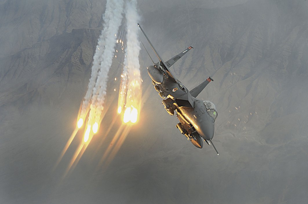 A US Air Force F-15E Strike Eagle dispenses flares during the supposed-height of the Afghan conflict in 2010. Despite a peace deal having been signed on 29 February, the US resumed air strikes just four days later in response to Taliban attacks on ANDSF checkpoints in Helmand province. (US DoD)