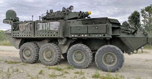 A Canadian LAV 6.0 is shown fitted with the ELSAT 2100 satcom on-the-move system.