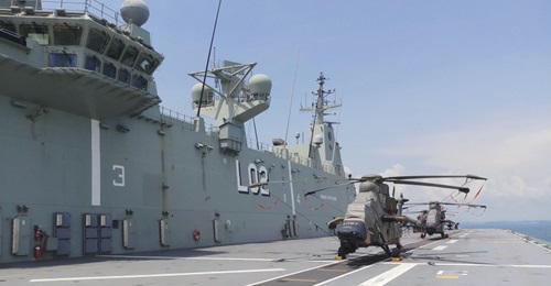 HMAS 
        
         seen here while it was berthed at Changi Naval Base, Singapore in 2019. The ship played an instrumental role at FCP20.