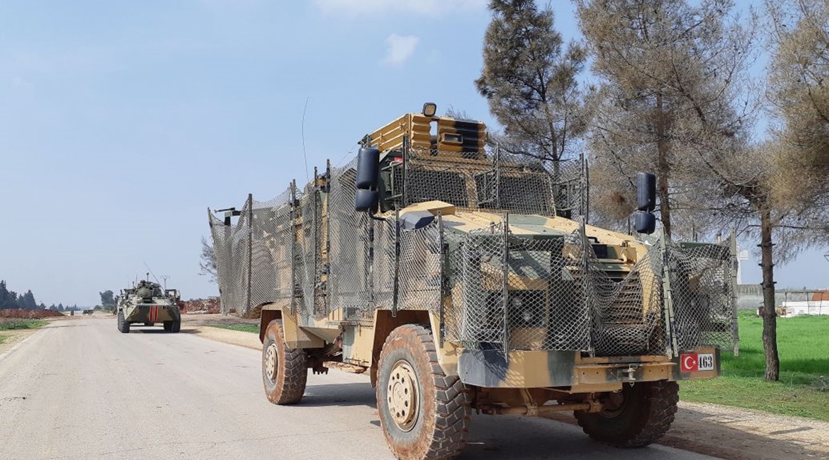 Turkish Kirpi and Russian BTR-80A armoured vehicles are seen carrying out the first joint patrol of the M4 highway in Idlib province on 15 March. The patrol's route had to be shortened because of local demonstrations and militant threats.