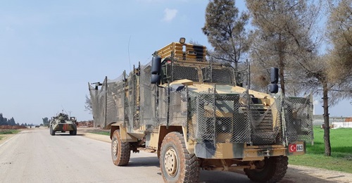 Turkish Kirpi and Russian BTR-80A armoured vehicles are seen carrying out the first joint patrol of the M4 highway in Idlib province on 15 March. The patrol's route had to be shortened because of local demonstrations and militant threats.