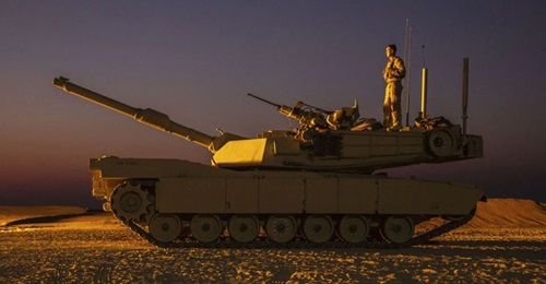Corporal Chance Marone, an M1A1 Abrams crewman assigned to India Company, Battalion Landing Team 3/5, 11th Marine Expeditionary Unit stands atop an M1A1 Abrams tank in September 2019. The USMC is planning to scrap its tank battalions in the coming year...