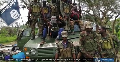 Militants in Mozambique pose with a captured ZBF-05 armoured personnel carrier in a photograph released by the Islamic State's Amaq News Agency on 2 February.