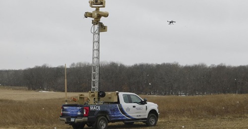 Northrop Grumman's Mobile Acquisition and Cueing Effector (M-ACE) hunter/killer CUAS prototype demonstrator, with the extended SDS-12 stabilised aluminium tower, based on a dedicated Ford F250 platform