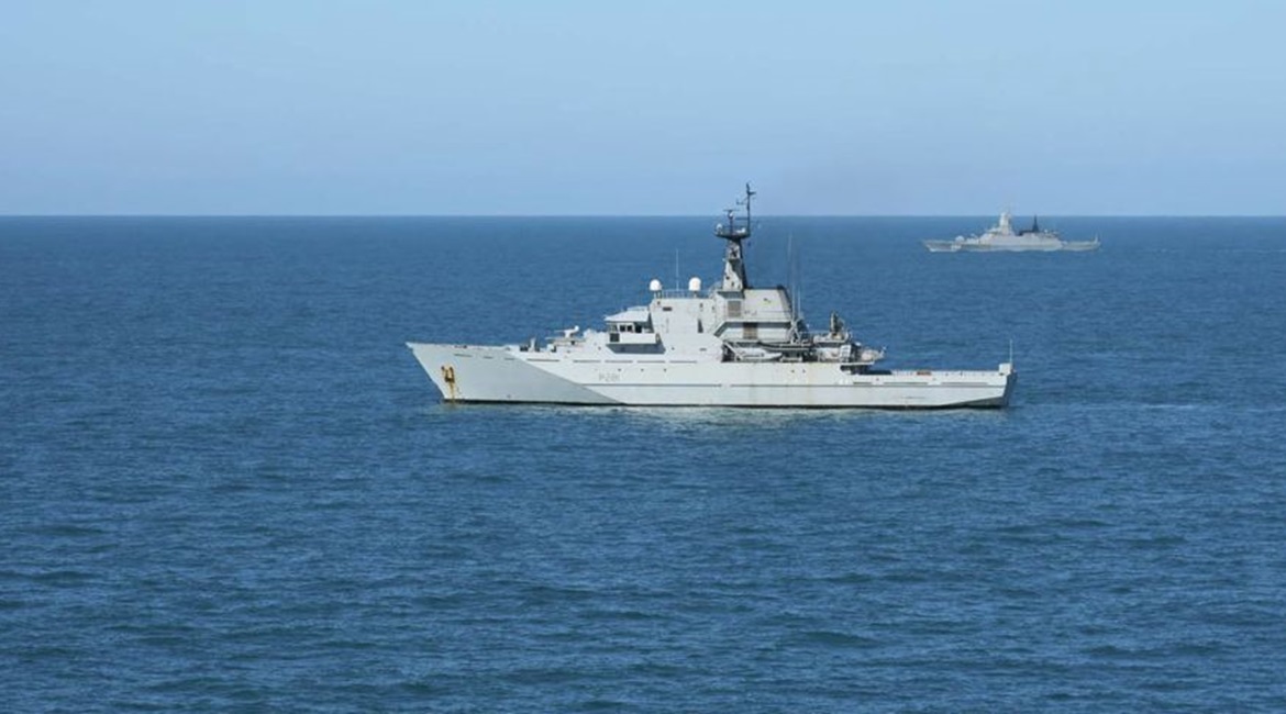 HMS 
        
         (foreground) shadowing the Russian corvette 
        
         (background) in waters around the UK.