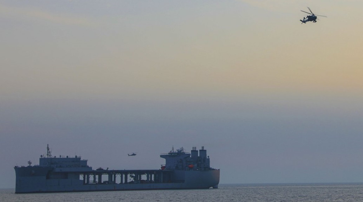 A US Army Apache attack helicopter operating from the Expeditionary Landing Base ship USS 
        
         (ESB 3) on 27 March.