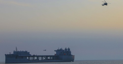 A US Army Apache attack helicopter operating from the Expeditionary Landing Base ship USS 
        
         (ESB 3) on 27 March.