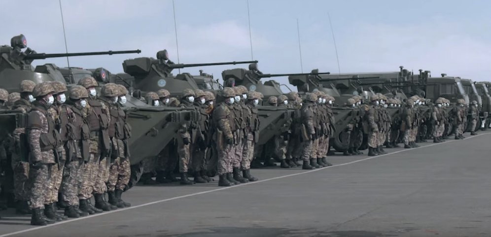 Kazakh troops alongside BTR-82A armoured personnel carriers and truck-mounted ARS-14KZ decontamination units ahead of a mission to help stem the spread of the Covid-19 coronavirus in their country. (Kazakh MoD)