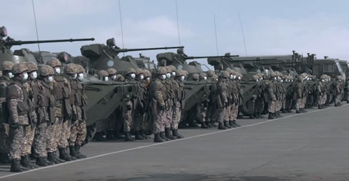 Kazakh troops alongside BTR-82A armoured personnel carriers and truck-mounted ARS-14KZ decontamination units ahead of a mission to help stem the spread of the Covid-19 coronavirus in their country.