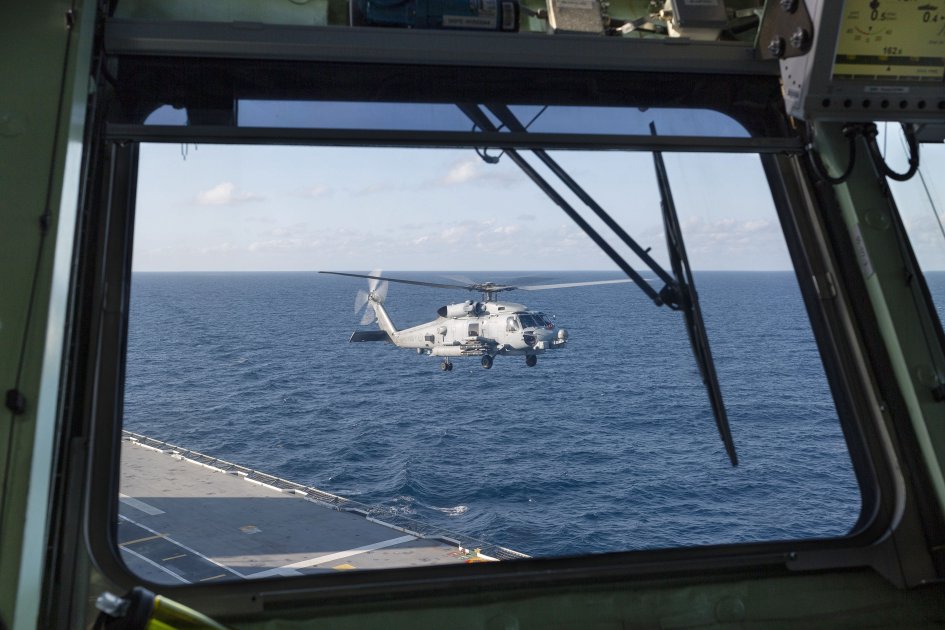 
        A RAN MH-60R helicopter prepares to land onboard HMAS
        Adelaide
        as it departs Sydney for first-of-class flight trials.
       (Royal Australian Navy)