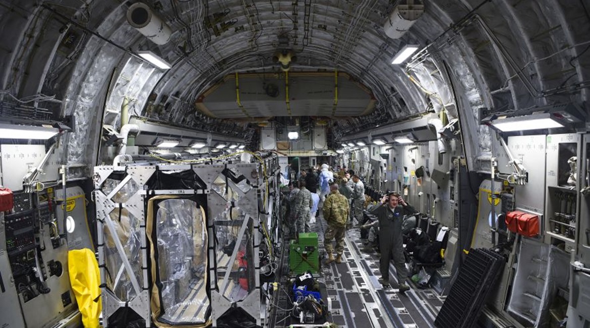 A US Air Force C-17 is prepped to transport a Transportation Isolation System (TIS) on 6 March 2019. The USAF on 10 April 2020 conducted the first operational use of the TIS to perform an aeromedical evacuation of three federal government contractors w...
