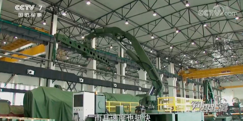 A screen grab from a CCTV 7 video showing what the broadcaster described as a “large, crane-like robot that can be used in lifting and loading missiles onto transporter-erector launchers”. The system is reportedly entering service with the PLA Rocket Force. (CCTV 7)