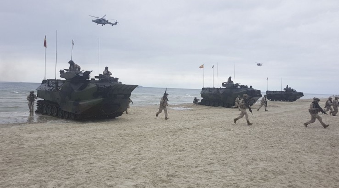 Spanish marines and armoured amphibious assault vehicles, deployed from the US Navy's Whidbey Island-class LSD amphibious assault ship USS Fort McHenry, come ashore on Palanga Beach, Lithuania, in an amphibious demonstration during 'BALTOPS 2019'. Due ...