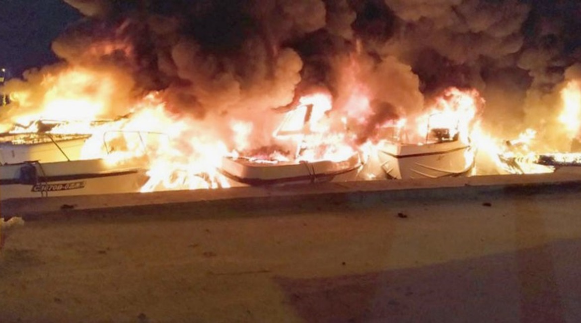 An image, published by the Maldives National Defence Force on 15 April, of the Islamic State-claimed arson attack on the coast of Mahibadhoo Island, South Ari Atoll.