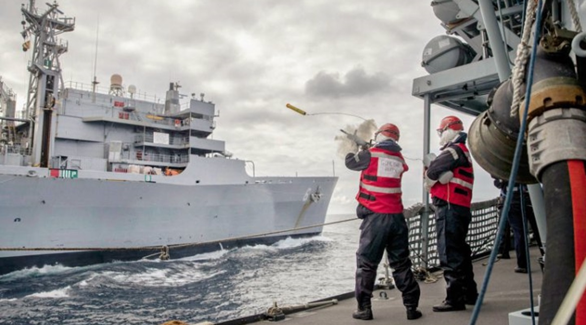 HMS 
        
         practising replenishment at sea with the USNS