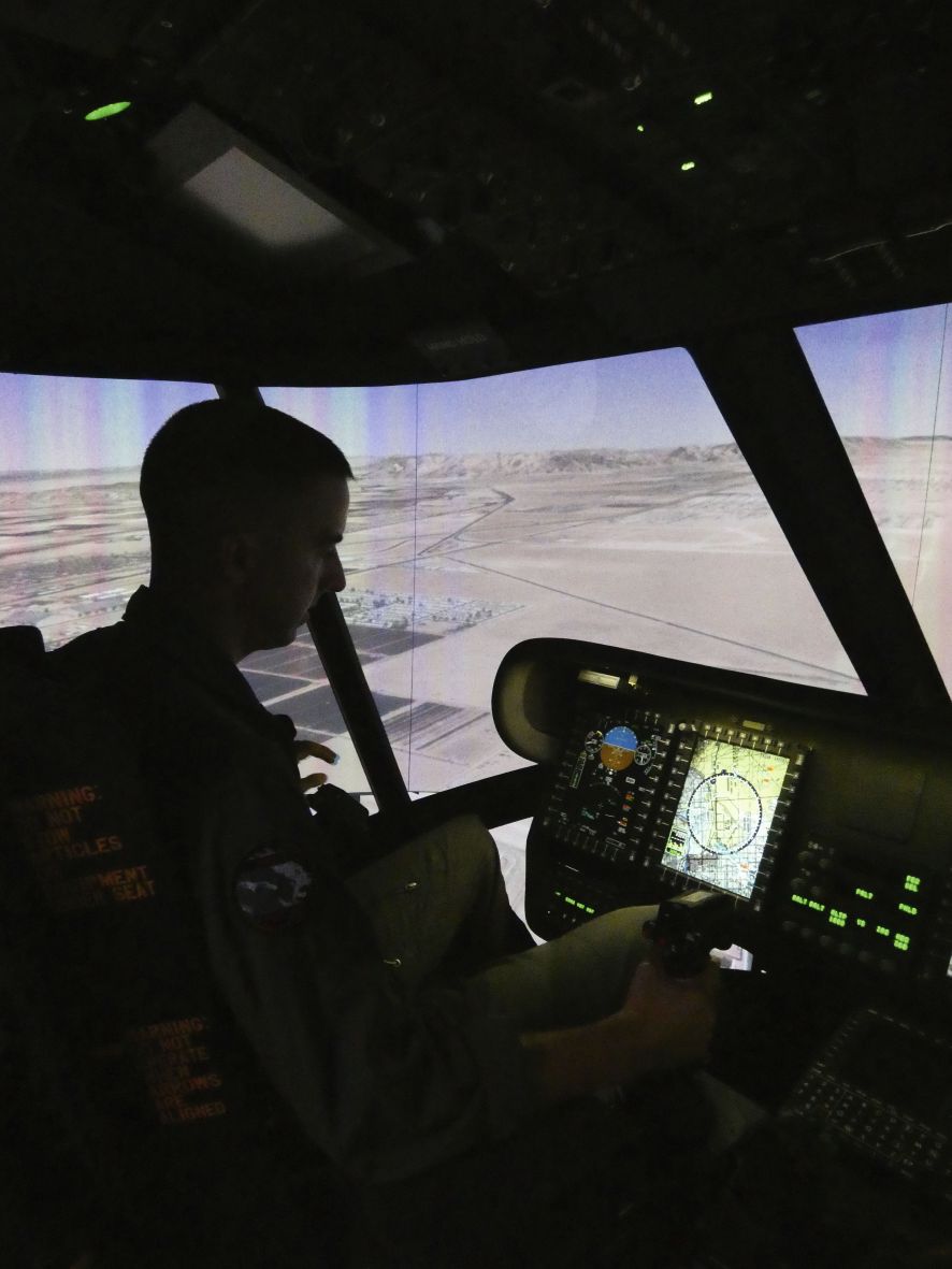 USMC pilot Lieutenant Colonel Lucas Frank takes the new CH-53K Containerized Flight Training Device (CFTD) simulator for a test drive. The marines took delivery of the CFTD on 14 April 2020. (US Navy)