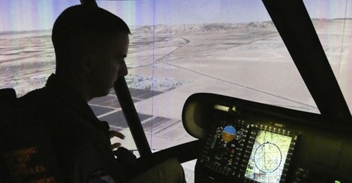 USMC pilot Lieutenant Colonel Lucas Frank takes the new CH-53K Containerized Flight Training Device (CFTD) simulator for a test drive. The marines took delivery of the CFTD on 14 April 2020.