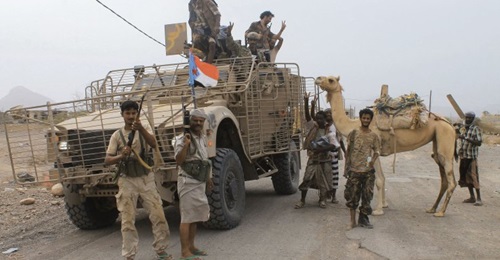 UAE-backed Yemeni forces are seen at Al-Anad Air Base in southern Yemen on 4 August 2015, soon after it was captured from Houthi rebels. The flag on the Oshkosh M-ATV is that of the defunct People's Democratic Republic of Yemen, indicating the fighters...