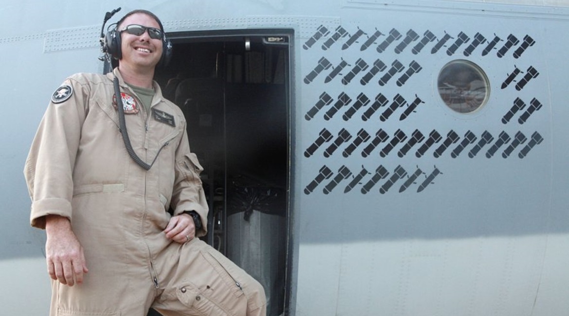 An airman poses next to the operational 'kill' markings stencilled onto the fuselage of a Harvest HAWK in Afghanistan during the war fighting stage of the conflict, giving an indication of the type's work rate in the CAS role. The USMC is now looking t...
