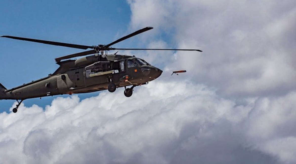 The Altius 600 UAS being launched from a UH-60 helicopter at low altitudes and in the hover position during a trial.