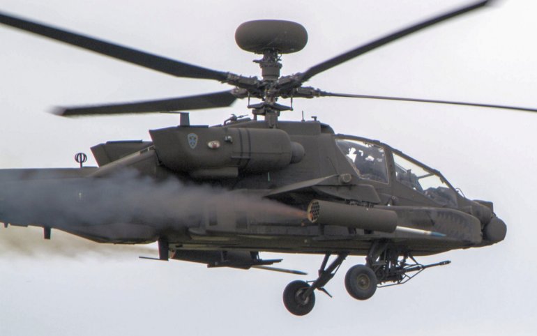 An Apache helicopter launching a Hydra 70 rocket. This weapon can be used as either an unguided air-to-surface munition or with the APKWS kit as a laser-guided munition.