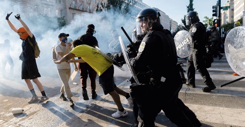 United States Park Police push back protesters near the White House in Washington, DC, on 1 June 2020. External influences on the protests appeared to be opportunistic rather than centrally directed, according to the US Department of Homeland Security.