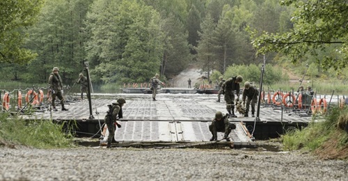 Polish troops prepare a bridge at the Drawsko Pomorskie training area on 8 June during exercise 'Allied Spirit'.