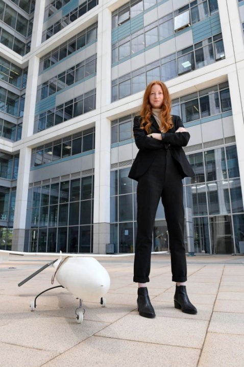 Neta Blum, the head of the Israeli MoD's Flight Technologies Department, standing next to the SkysPrinter.